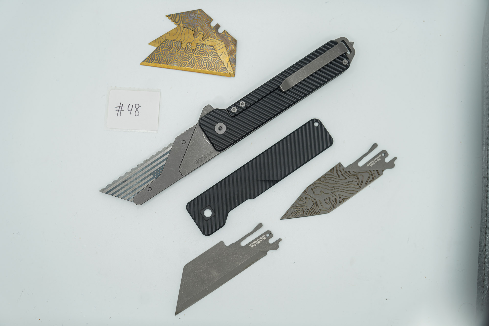 BUILD #48 Combo — Condition 10/10 — TiRant ULTRA Carbon Fiber USA-Milled Deep Slash RH Scale + Jet-Black PVD Deep Slash LH Scale + Original Deep Slash RH Ti Black PVD Scale + Installed Skeleton Glass-Breaker Rear Spacer + 4X Custom Laser Engraved Razor Blades + D2 Full-Razor Style Hotswap Blade + Half Tanto Topo Lasered Blem Blade - Image 3