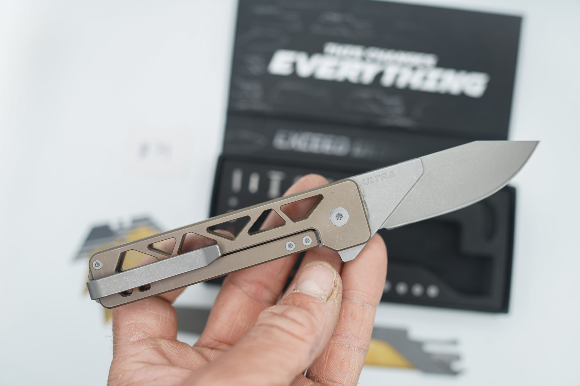 BUILD #74 — Condition 8/10 — TiRant ULTRA Skeleton 'SKULTRA' Centurion Bronze W/Blasted Grey Hardware + Original Box W/Spare Grey Blasted Hardware Kit / Lock Bar insert + D2 Hawkbill Hotswap Blade + D2 Stonewashed Drop Point Hotswap Blade + 3X Custom Laser Engraved Razor Blades - Image 3