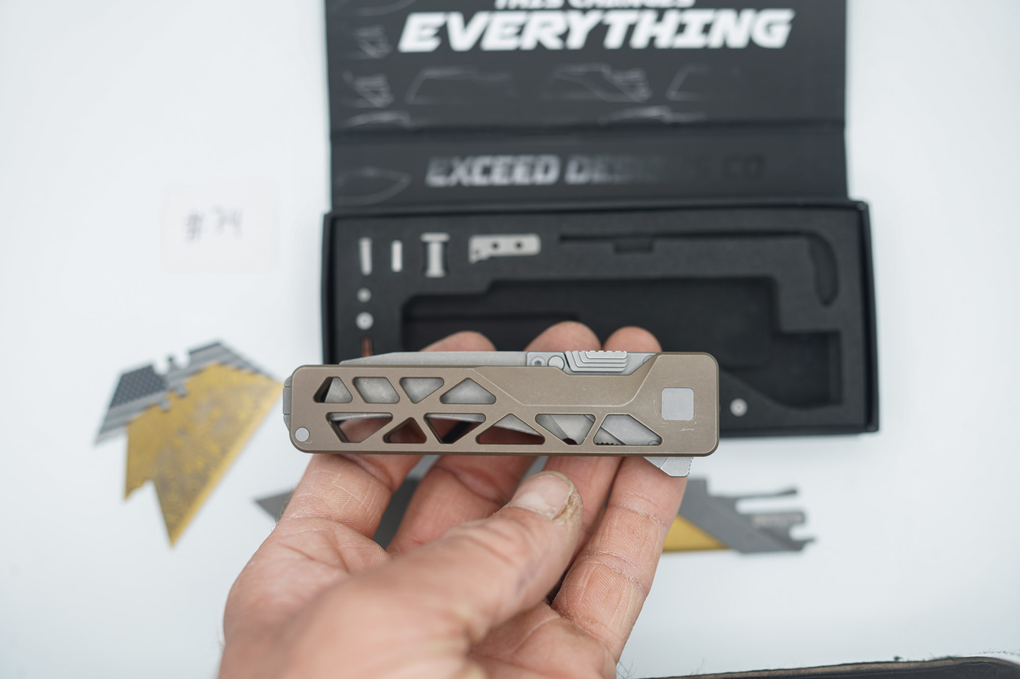 BUILD #74 — Condition 8/10 — TiRant ULTRA Skeleton 'SKULTRA' Centurion Bronze W/Blasted Grey Hardware + Original Box W/Spare Grey Blasted Hardware Kit / Lock Bar insert + D2 Hawkbill Hotswap Blade + D2 Stonewashed Drop Point Hotswap Blade + 3X Custom Laser Engraved Razor Blades - Image 6
