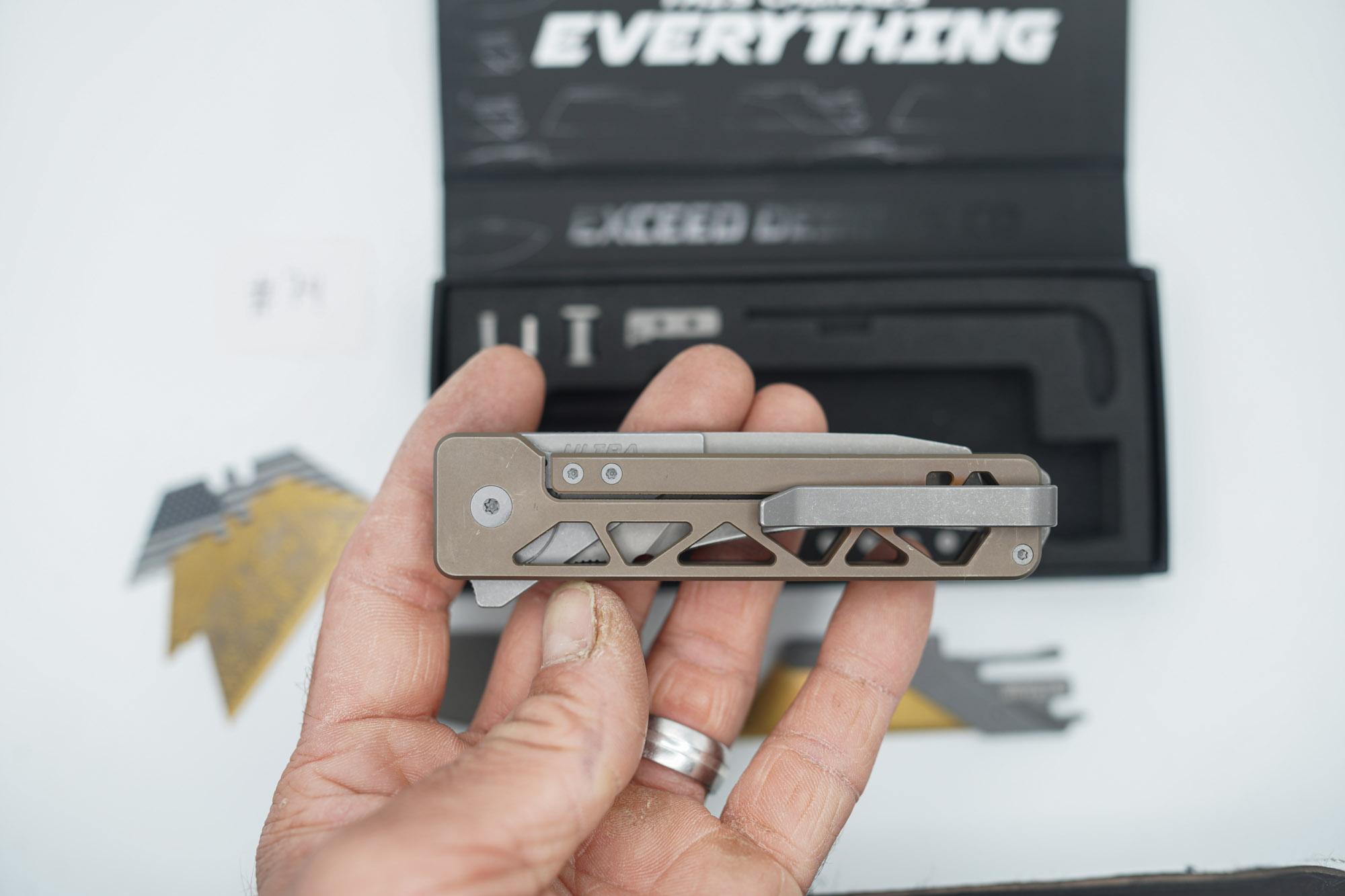 BUILD #74 — Condition 8/10 — TiRant ULTRA Skeleton 'SKULTRA' Centurion Bronze W/Blasted Grey Hardware + Original Box W/Spare Grey Blasted Hardware Kit / Lock Bar insert + D2 Hawkbill Hotswap Blade + D2 Stonewashed Drop Point Hotswap Blade + 3X Custom Laser Engraved Razor Blades - Image 7