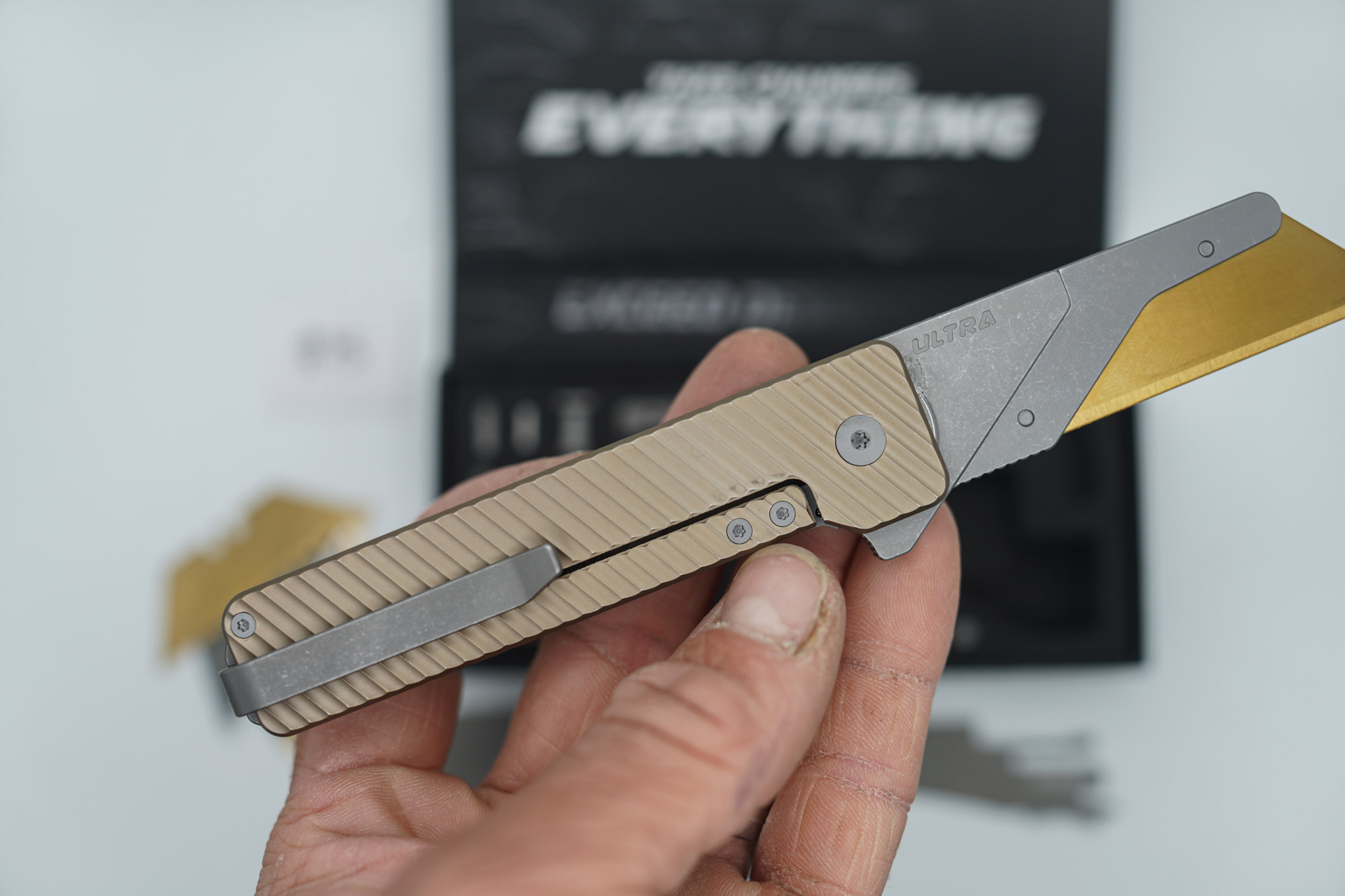 BUILD #75 — Condition 9/10 — TiRant ULTRA Deep-Slash DUAL Milled Centurion Light-Bronze - Minor Blem in ANO finish (See Photos) W/Blasted Grey Hardware + Original Box W/Spare Grey Blasted Hardware Kit / Lock Bar insert + D2 Stonewashed Hawkbill Hotswap Blade + D2 Stonewashed Drop Point Hotswap Blade + 3X Custom Laser Engraved Razor Blades - Image 3