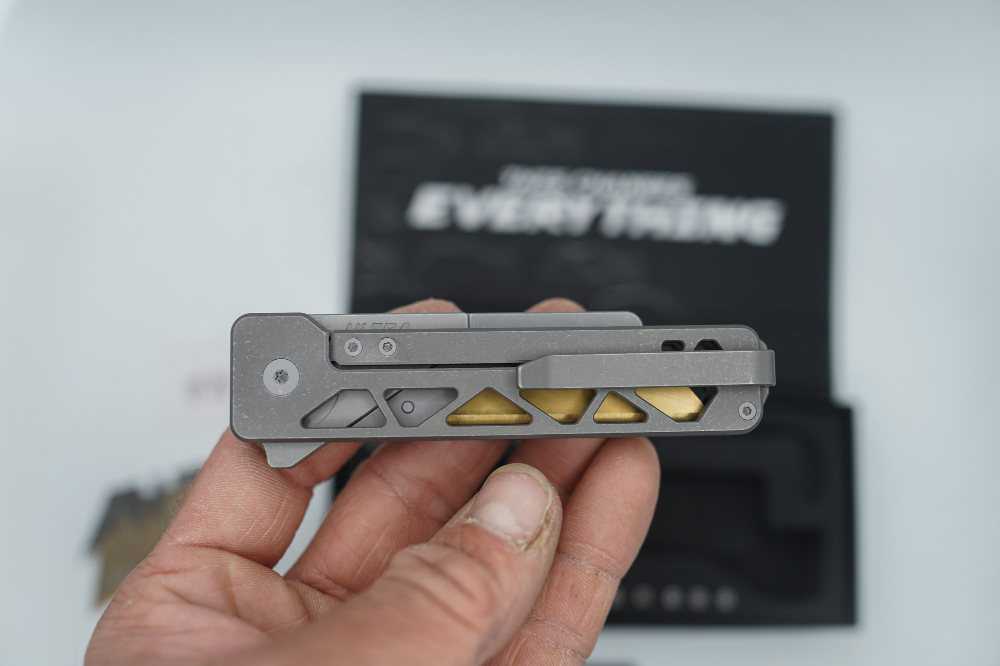 BUILD #80 — Condition 9/10 — TiRant ULTRA Skeleton 'SKULTRA' Dark Wash Titanium W/Blasted Grey Hardware + Original Box W/Spare Grey Blasted Hardware Kit / Lock Bar insert + M390 1.5MM Full RAZOR Hotswap Blade (Minor Blem, See Photos) + D2 Jet-Black Tanto Hotswap Blade + 3X Custom Laser Engraved Razor Blades - Image 5